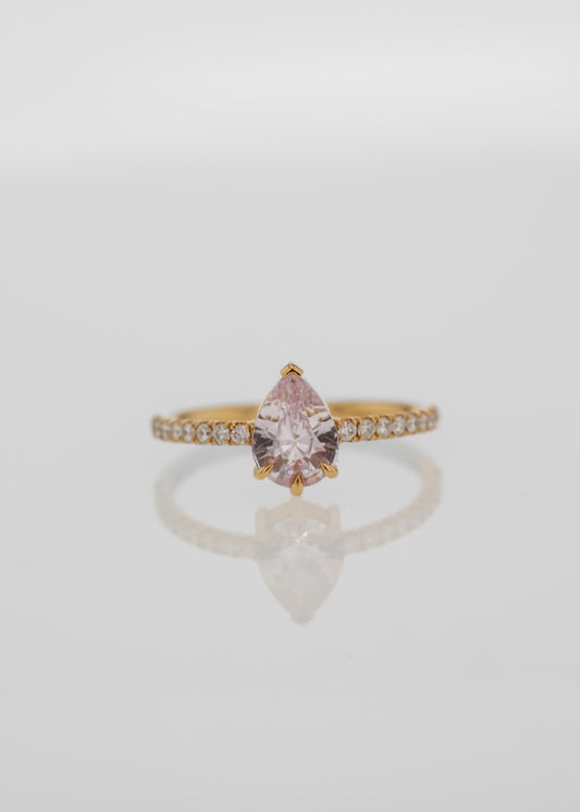 pink sapphire engagement ring, pear-cut pink sapphire, yellow gold sapphire ring, pavé engagement ring, romantic fine jewelry, alternative engagement ring, feminine bridal ring, ethical gemstone ring