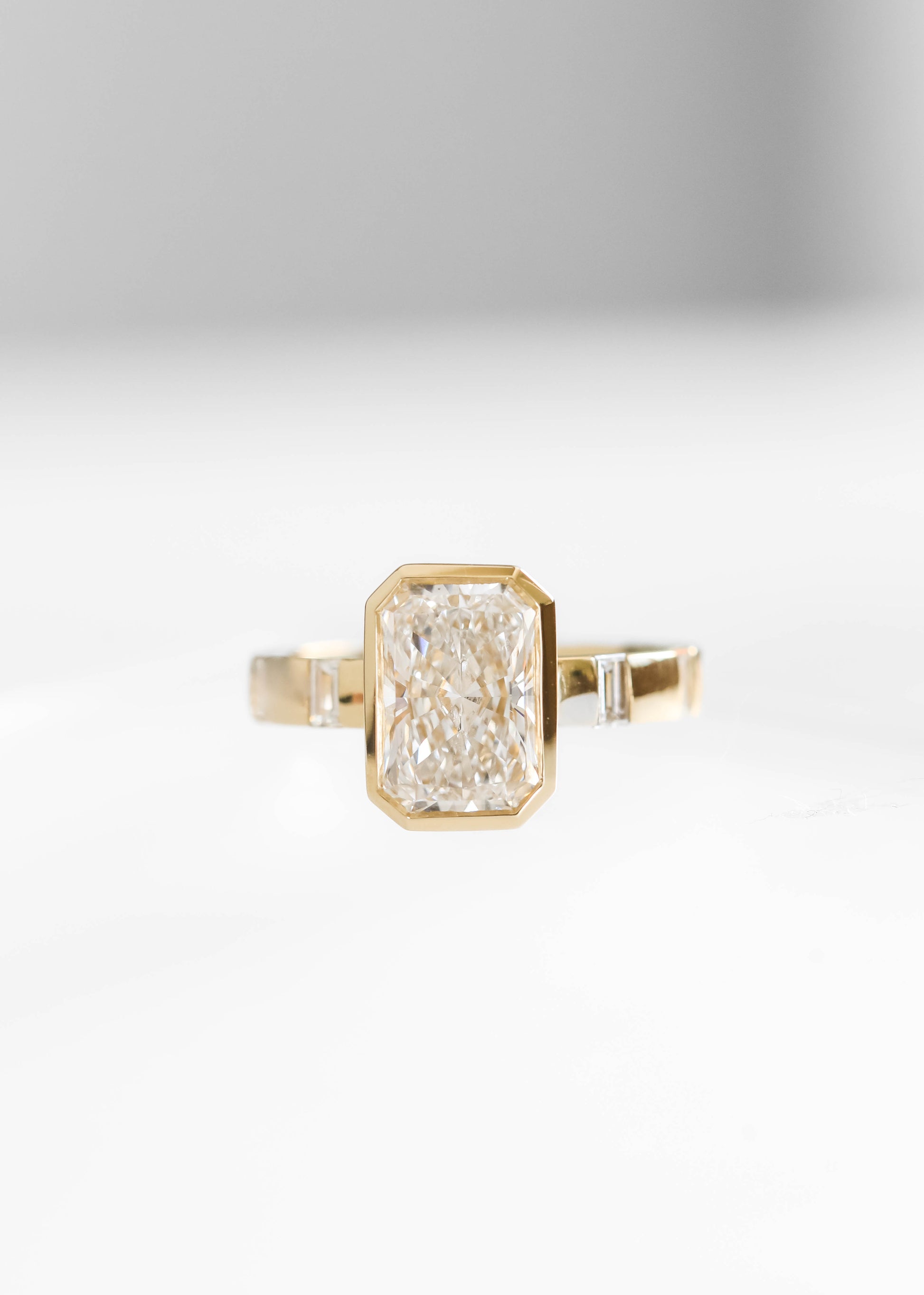radiant cut lab diamond engagement ring, 14k yellow gold engagement ring, Lennon setting ring, bezel radiant diamond ring, baguette side stone engagement ring, modern engagement ring, lab grown diamond ring, minimalist bridal jewelry
