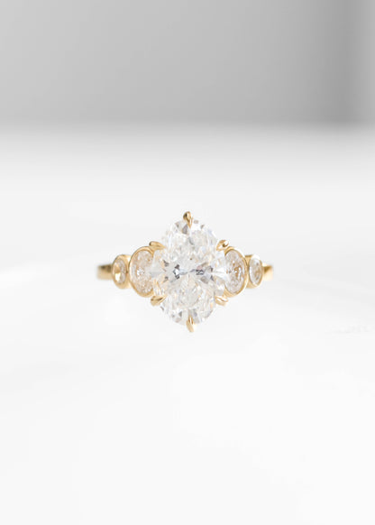 oval lab diamond engagement ring, 14k yellow gold engagement ring, Adelaide setting ring, oval diamond ring, bezel side stone engagement ring, lab grown diamond ring, timeless engagement ring, modern bridal jewelry