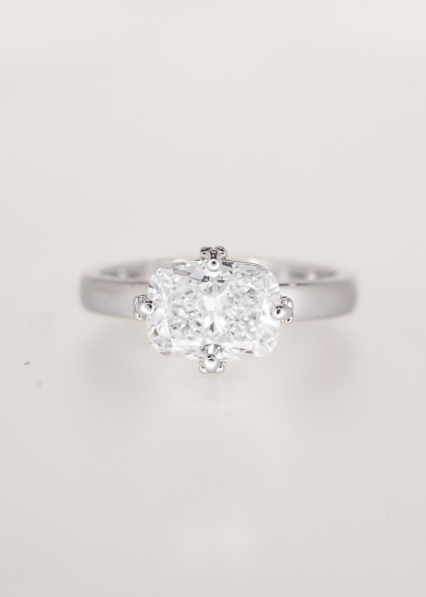 Lavender sprig prong east west elongated cushion lab grown diamond lesbian engagement ring in 14K white gold, pairs with the Greta