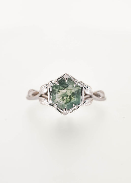 Nature inspired hexagon cut moss agate engagement ring in 14K white gold with a six prong basket and sculpted leaf and vine band