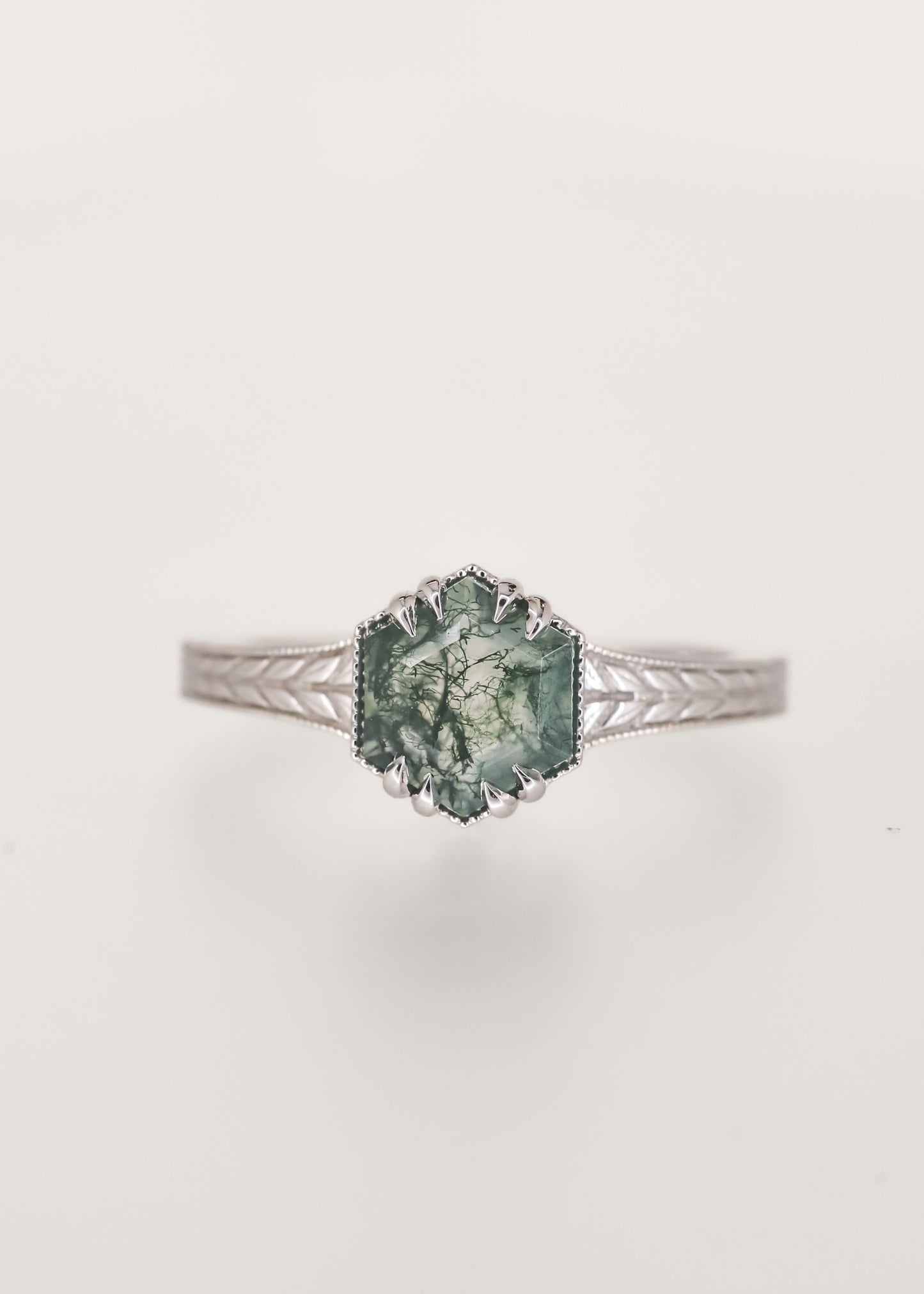Nature inspired hexagon cut moss agate engagement ring in 14K white gold with milgrain and an engraved wheat band