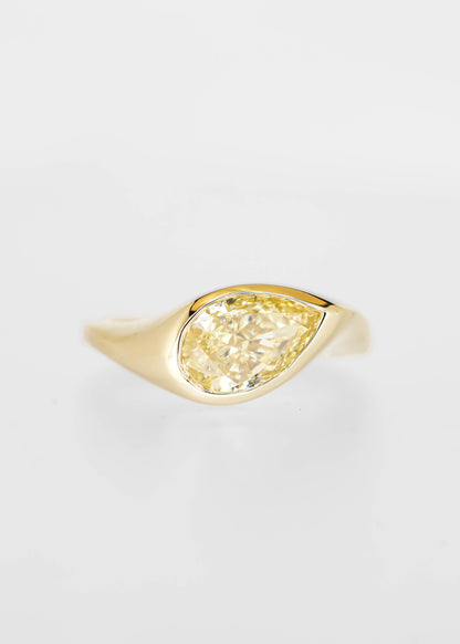 East west bezel set pear lab grown yellow diamond signet engagement ring in 14K yellow gold
