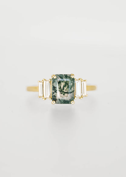 Emerald cut moss agate engagement ring in 14K yellow gold with graduated baguette diamond accent stones
