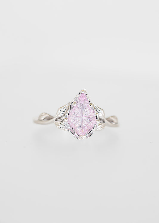 Starbright cut purple sapphire engagement ring in 14K white gold with a carved leaf gallery and twisted vine band