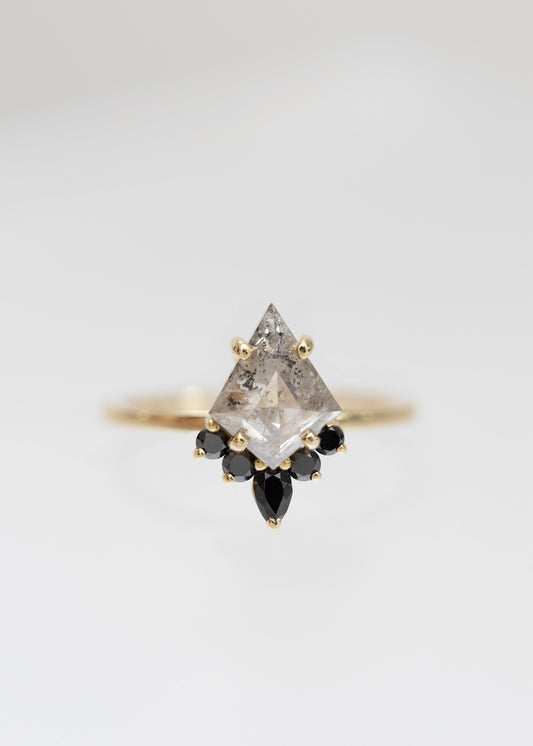 Kite cut salt and pepper diamond engagement ring in 14K yellow gold with a black diamond accent half-halo and pear accent