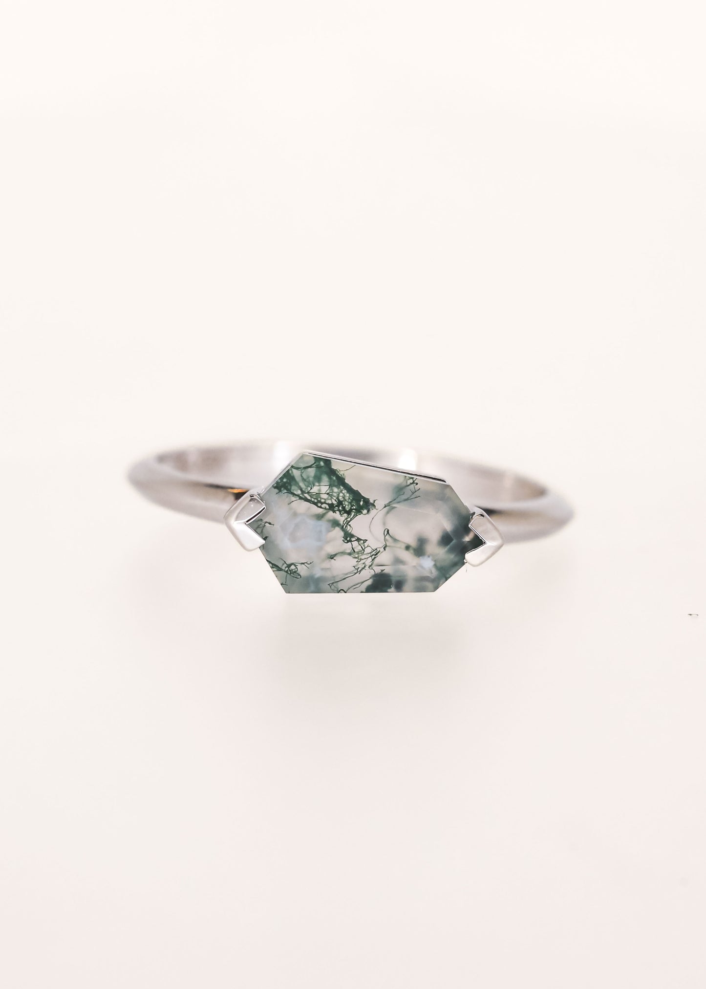 Minimal east west kite cut moss agate engagement ring in 14K white gold with half bezel setting