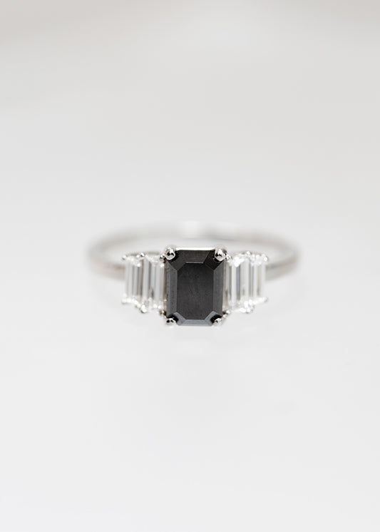 Art Deco emerald cut black diamond engagement ring in 14K white gold with graduated baguette side stones