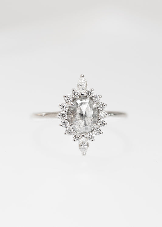 Oval salt and pepper diamond starburst halo engagement ring in 14K white gold with marquise diamond accents