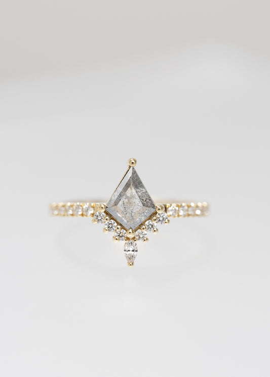 Kite cut salt and pepper diamond engagement ring in 14K yellow gold with a diamond accent crown, marquise accent, and pavé band