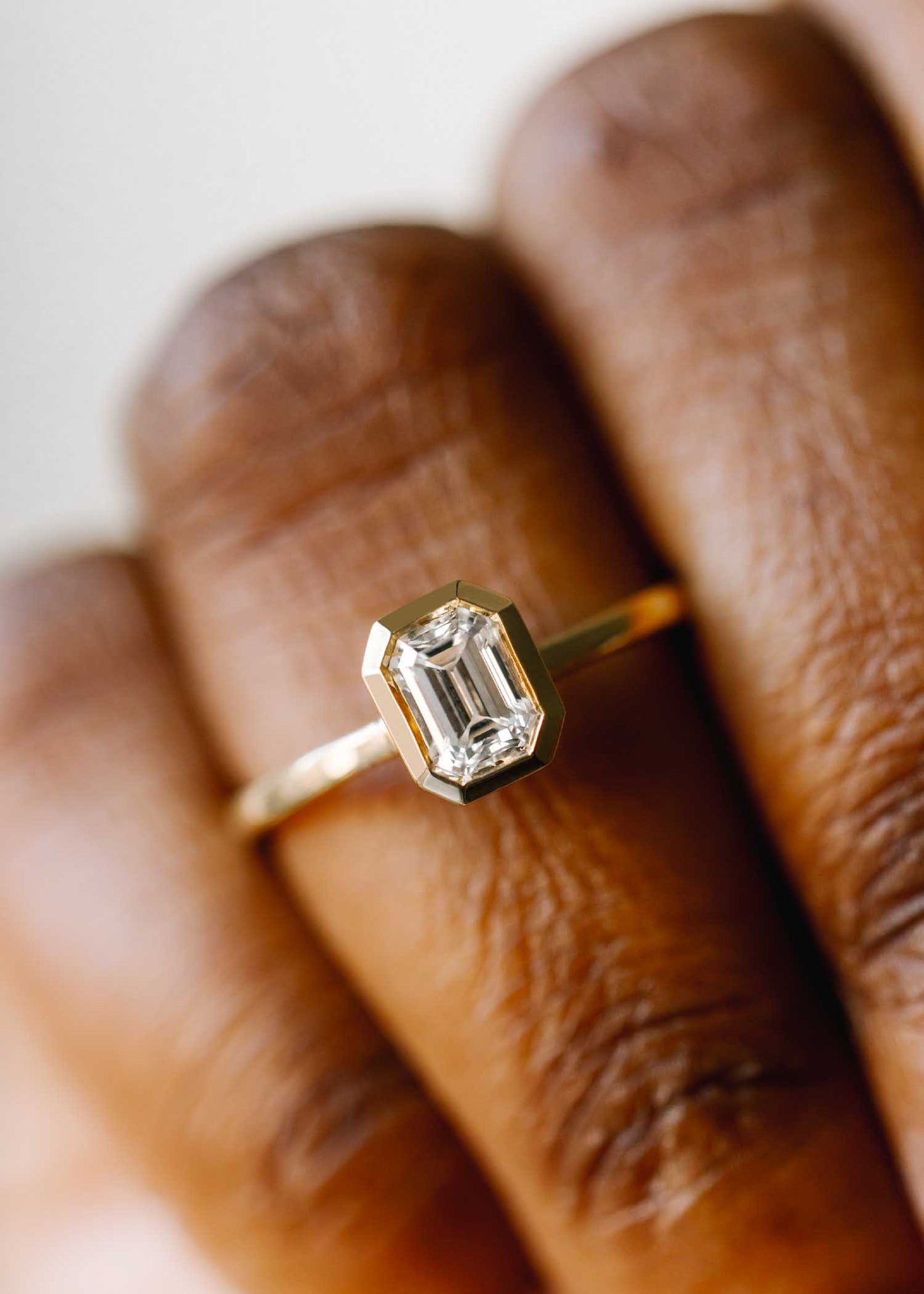 The Leda | .64ct Emerald Cut Diamond | Yellow Gold