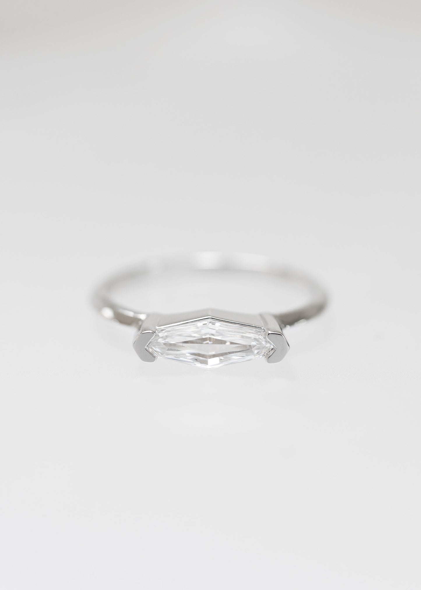 Minimal east west step marquise natural diamond engagement ring in 14K white gold with half bezel setting