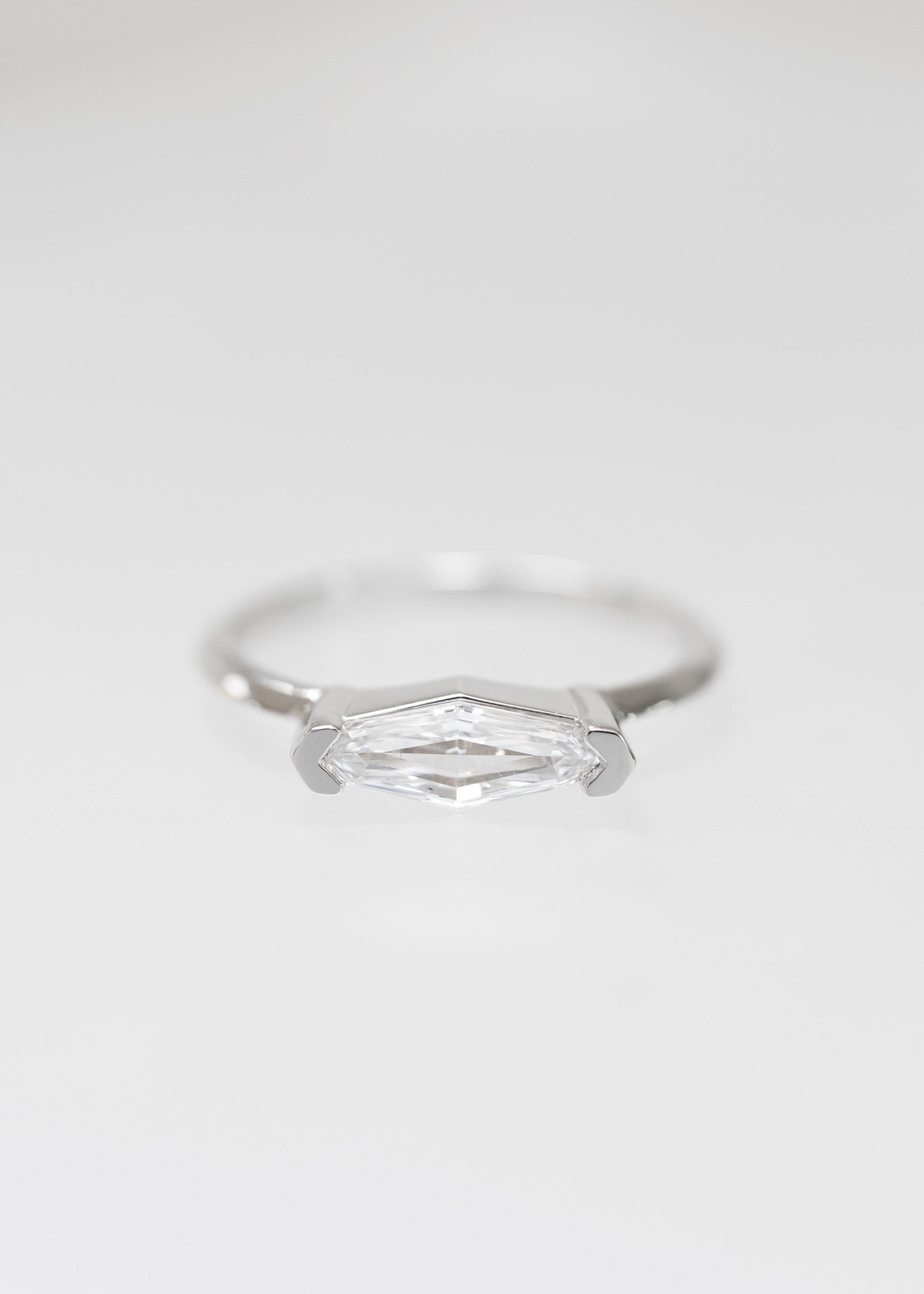 Minimal east west step marquise natural diamond engagement ring in 14K white gold with half bezel setting