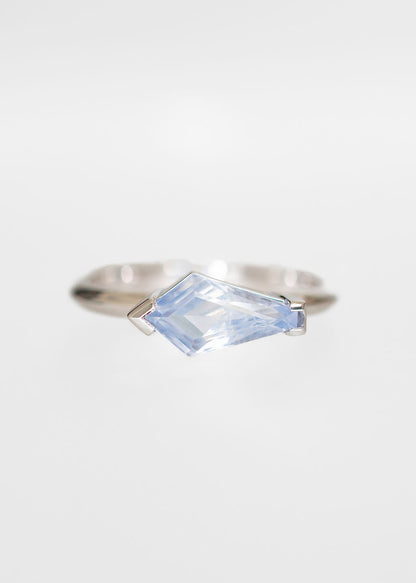 Minimal east west shield cut icy blue sapphire engagement ring in 14K white gold with half bezel setting